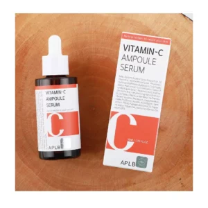 Vitamin-C Ampoule Serum bottle and box with wooden background